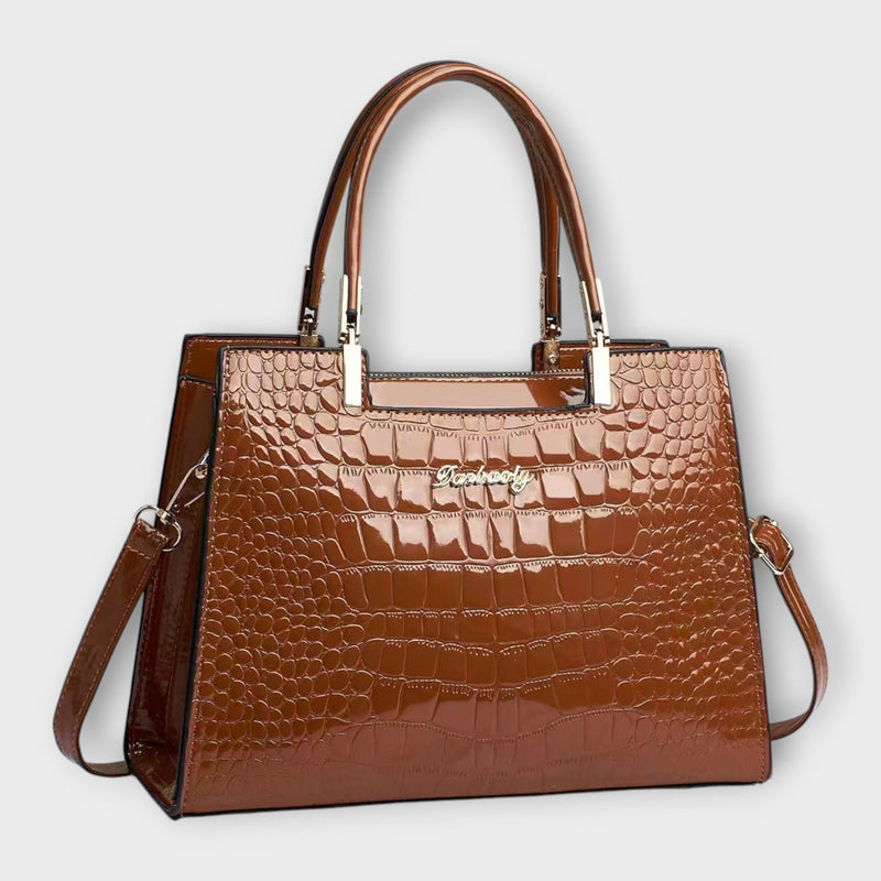 Bolso de mano con estampado de cocodrilo brillante