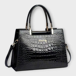 Bolso de mano con estampado de cocodrilo brillante