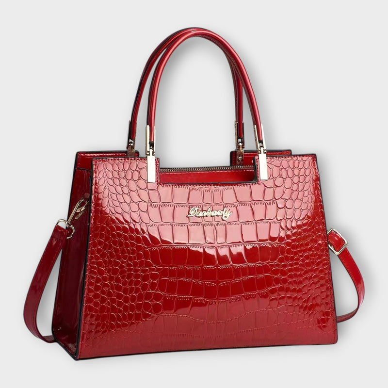 Bolso de mano con estampado de cocodrilo brillante