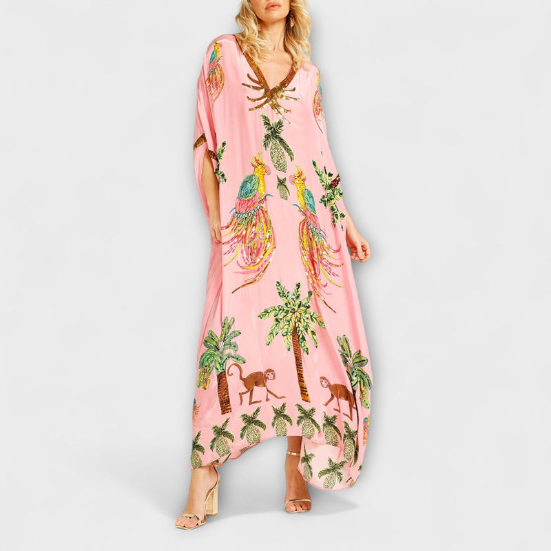 Linda - Vestido llamativo con hombros asimétricos y estampado de palmera