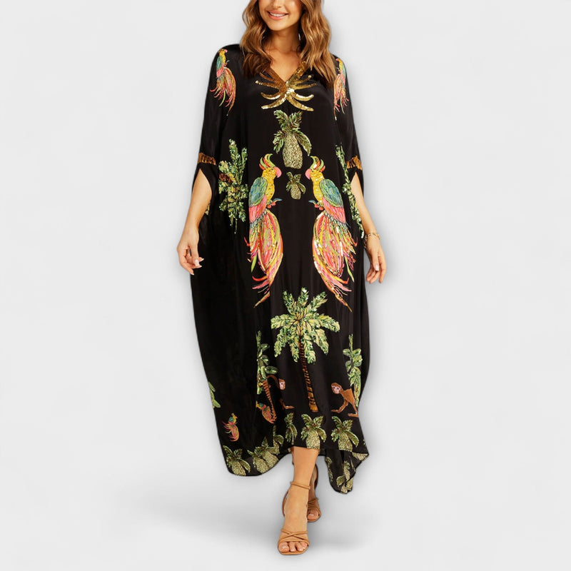 Linda - Vestido llamativo con hombros asimétricos y estampado de palmera