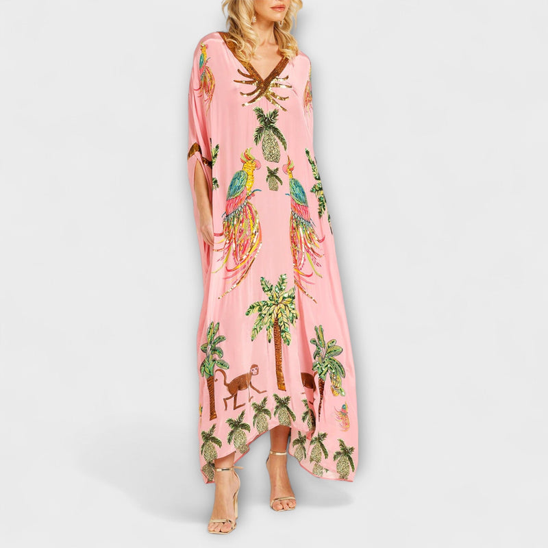 Linda - Vestido llamativo con hombros asimétricos y estampado de palmera