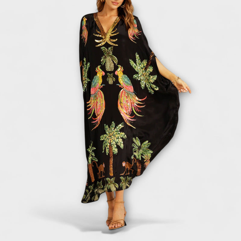 Linda - Vestido llamativo con hombros asimétricos y estampado de palmera